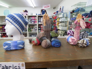 Models made from our new yarn.  Cap made by Kathy Hagan and the gloves made by Stella Sanders.